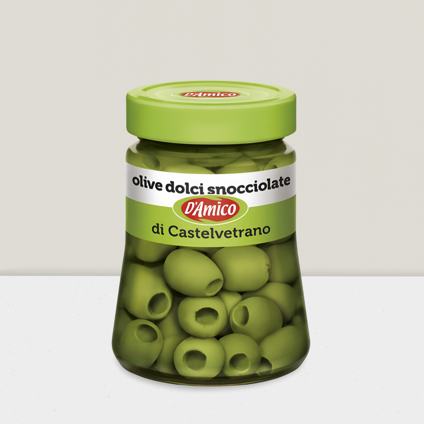 Jar of green olives with a green lid on a white background