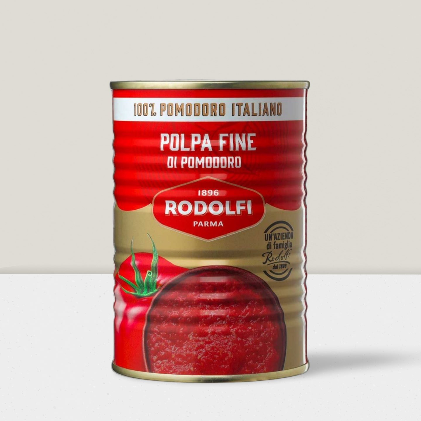 Tin can with Rodolfi tomato paste label on a light gray background