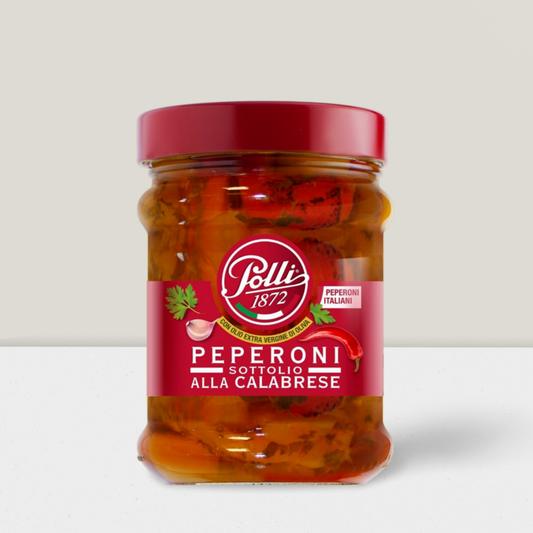 Roasted Italian peppers in oil in a glass jar