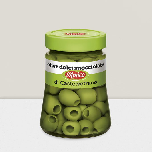 Jar of green olives with a green lid on a white background