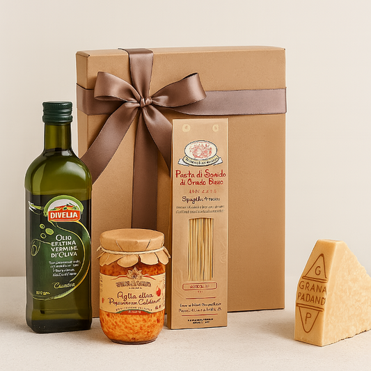 Gift set with olive oil, pasta, and cheese on a beige background