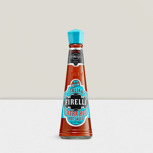 Firelli hot sauce bottle with blue cap on a light gray background