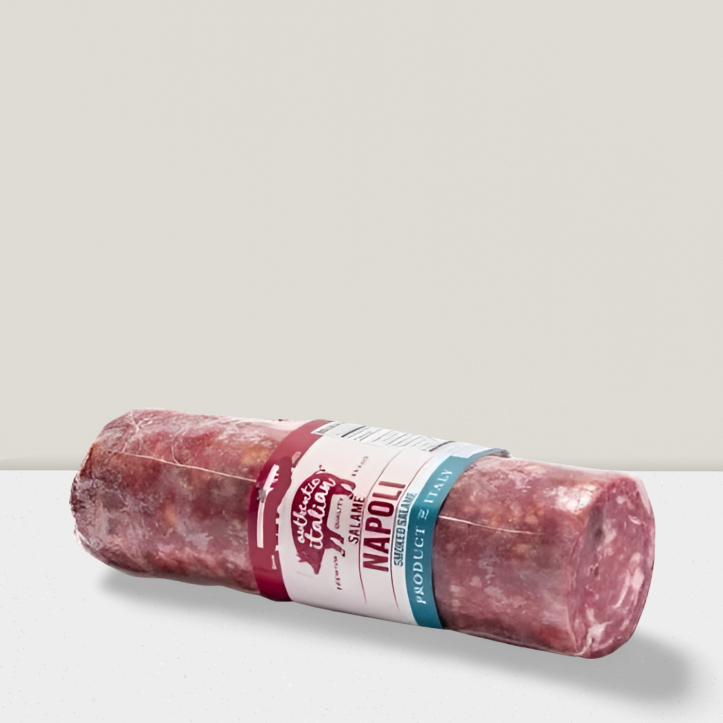 Rolled salami with a brand label on a light gray background
