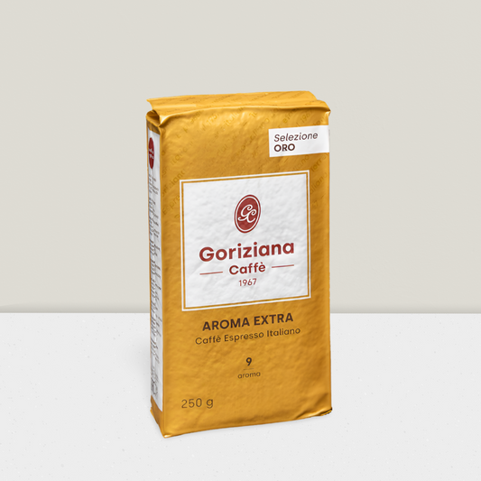 Gold coffee bag with Goriziana Caffe branding on a light gray background