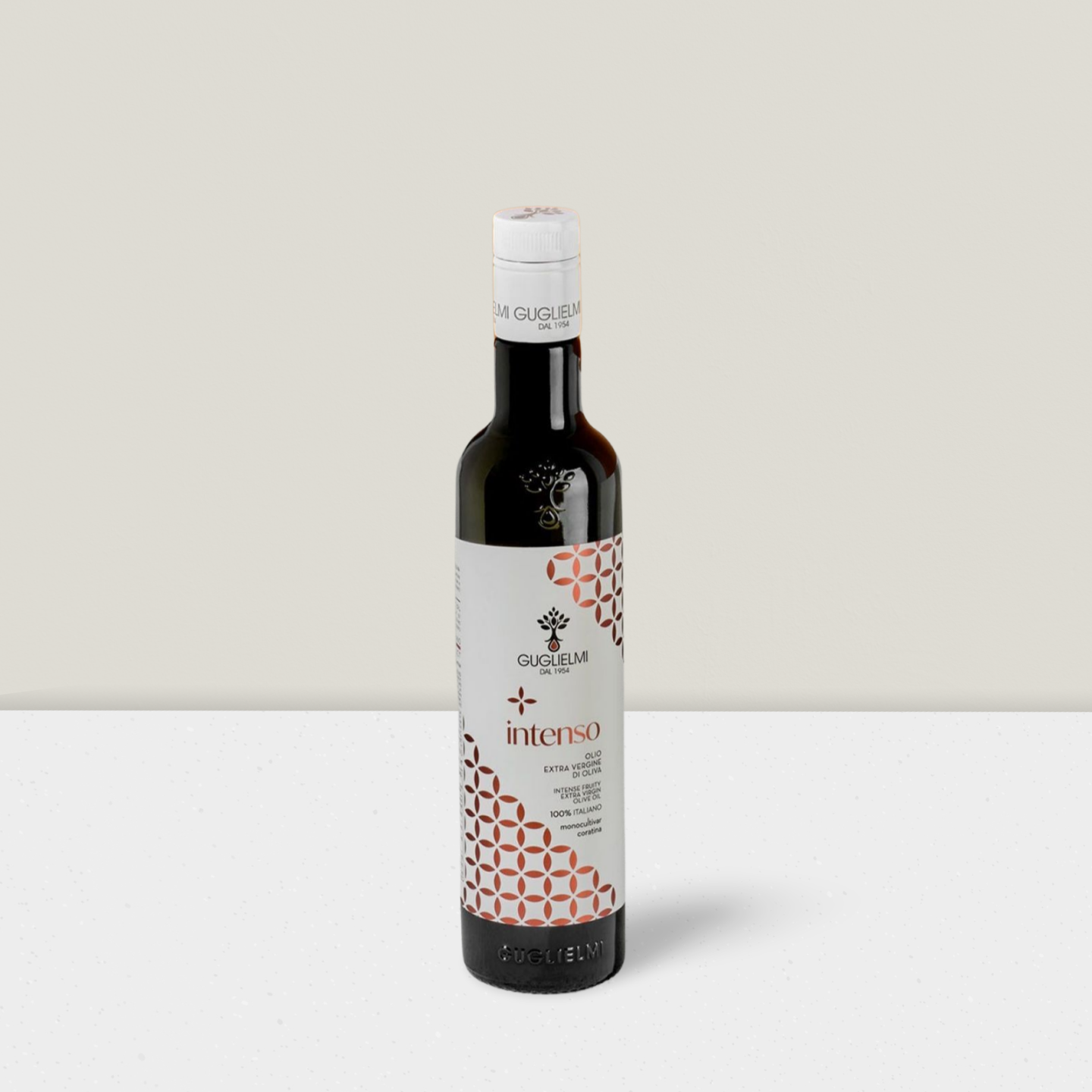 Bottle of olive oil with a decorative label on a light gray background