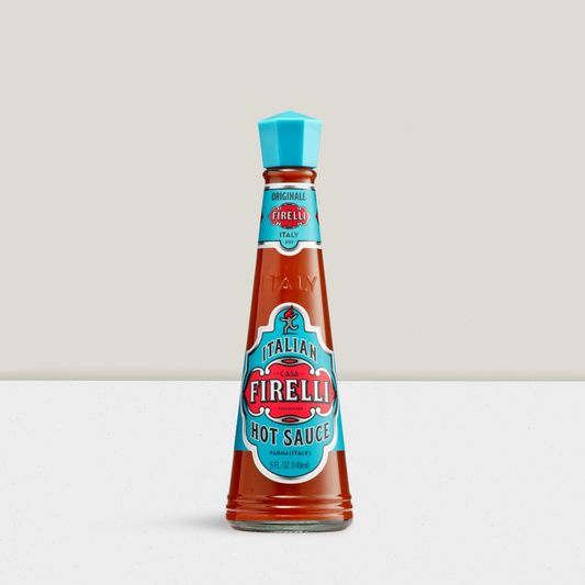 Firelli hot sauce bottle on a white background