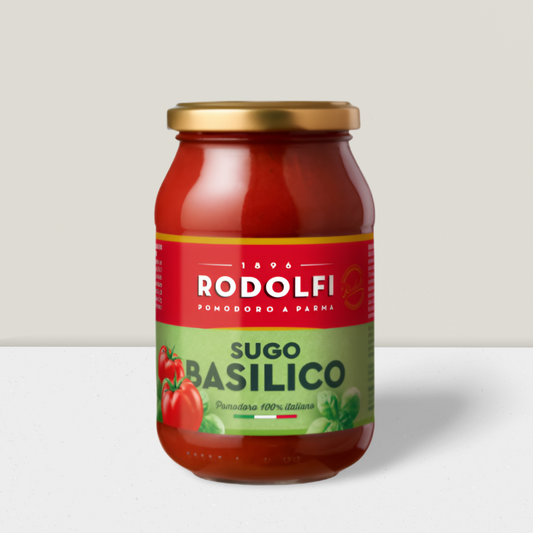 Bottle of Tomato and basil sauce on a grey background