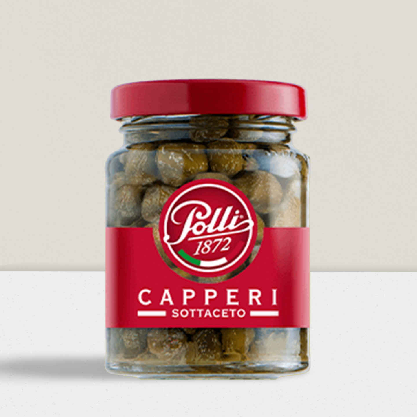 Small capers in a glass jar from the brand Polli