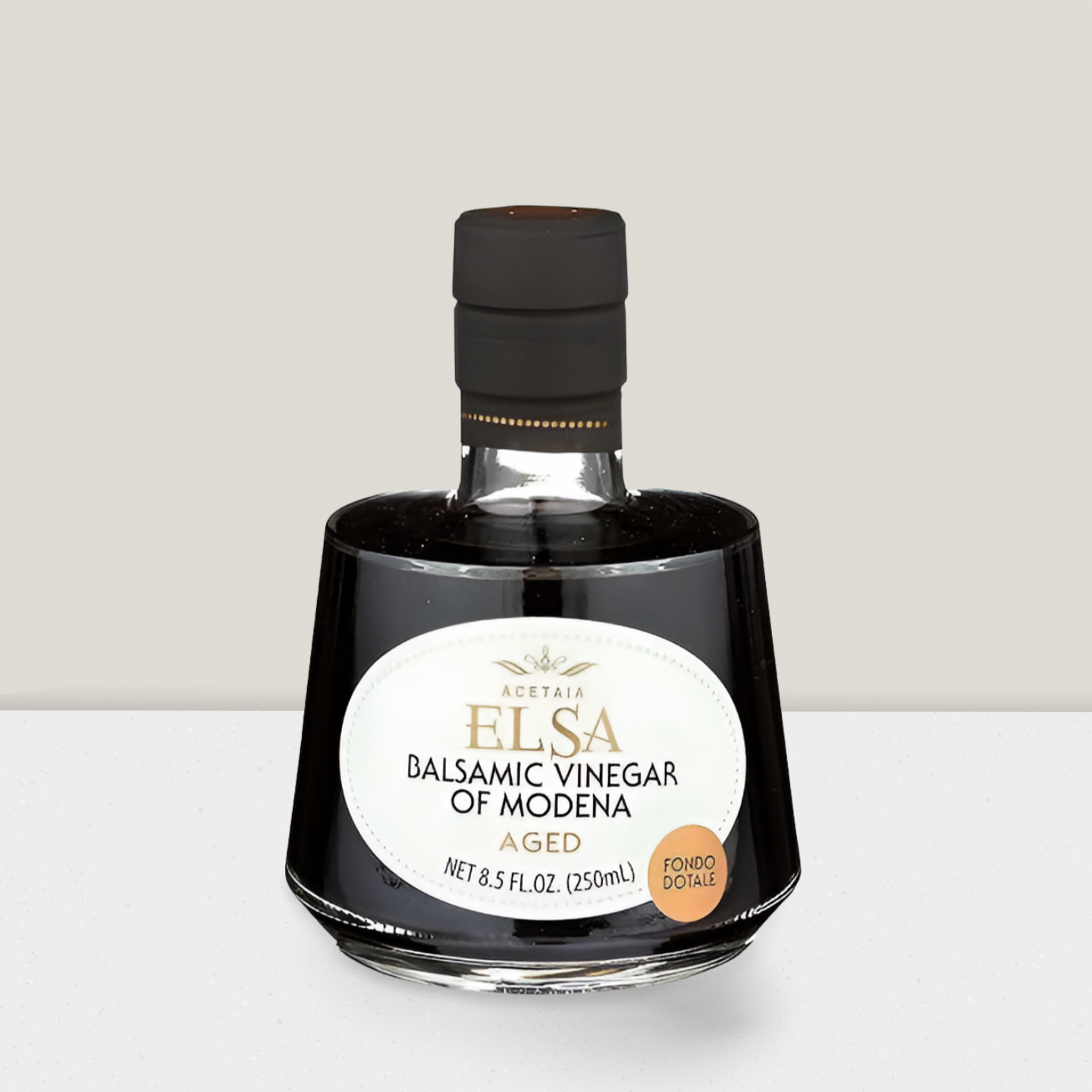 bottle of Elsa balsamic aged vinegar on  a grey background