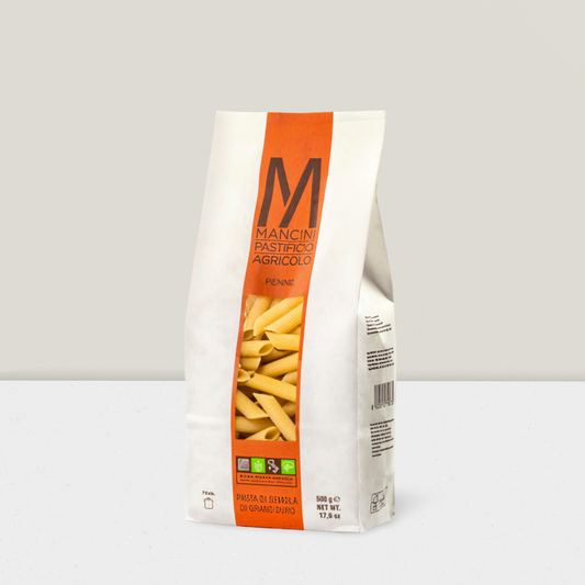 Bag of Mancini pasta with an orange label on a white background