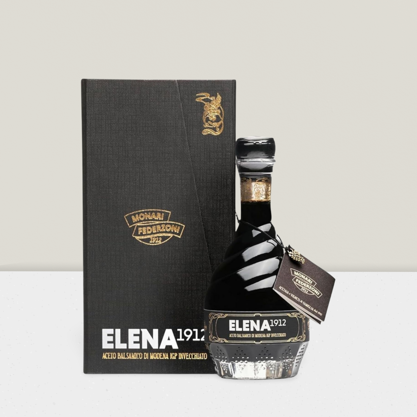 Bottle of Elena 1912 with packaging on a light gray background