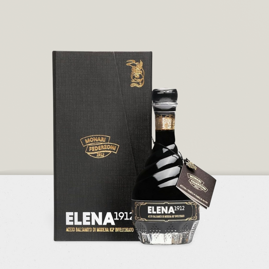 Bottle of Elena 1912 with packaging on a light gray background