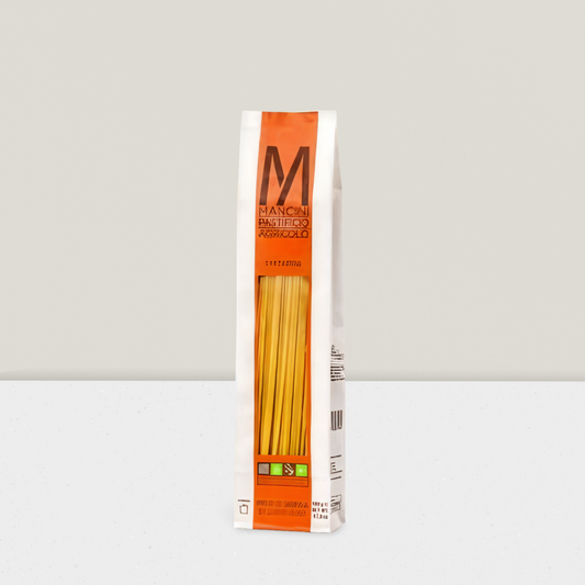 Box of Mancini pasta on a light gray background